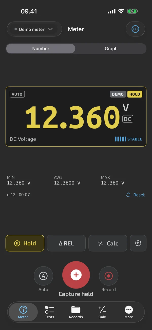 Meter screen in TestNMeasure: reading frozen by the app's HOLD, digits shown in yellow